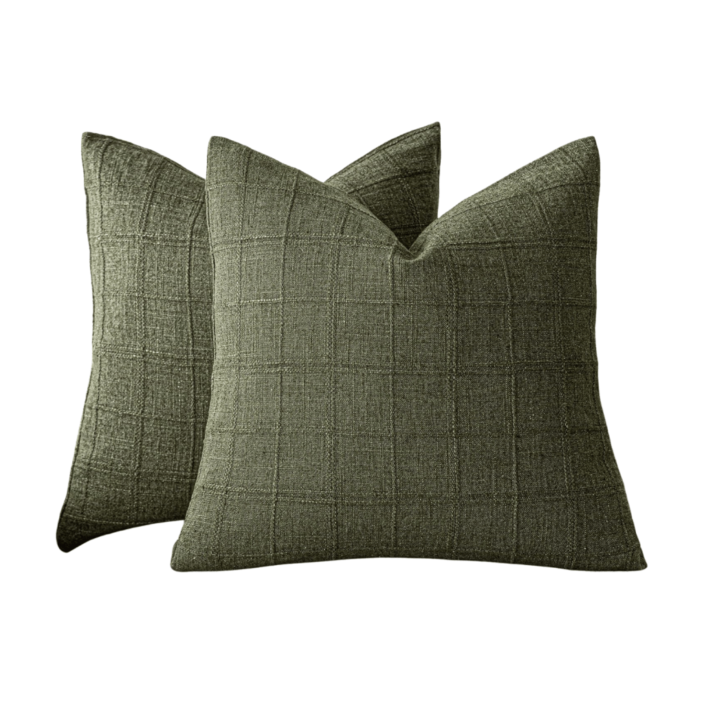 Two green decorative pillows with a textured grid pattern.